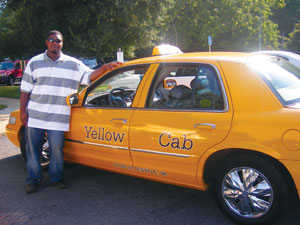  Before going to work as a nursing assistant at the University of Virginia Medical Center, Jesse "LJ" Matthew drove a taxi in Charlottesville for many years. He's shown here with his Yellow Cab in 2007. 