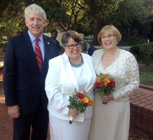 Attorney General Mark Herring and Plaintiffs Carol Schall and Mary Townley celebrate.