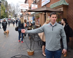 Kevin Badke shows how he extended his arm to return the ID card.