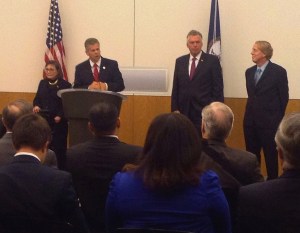 House Majority Leader Kirk Cox (podium) joined other  lawmakers and Gov. McAuliffe to unveil the plan.