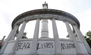 This June 25, 2015, the words Black Lives Matter spray painted on a monument to former Confederate President Jefferson Davis in Richmond, Va. Confederate monuments in a half-dozen places this week have been defaced _ a telling sign of the racial tension that permeates post-Ferguson America. AP Photo/Steve Helber, 